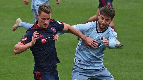 Fabian Herbers of Chicago Fire fighting for the ball against Illie Sanchez of Sporting Kansas City. (Getty)