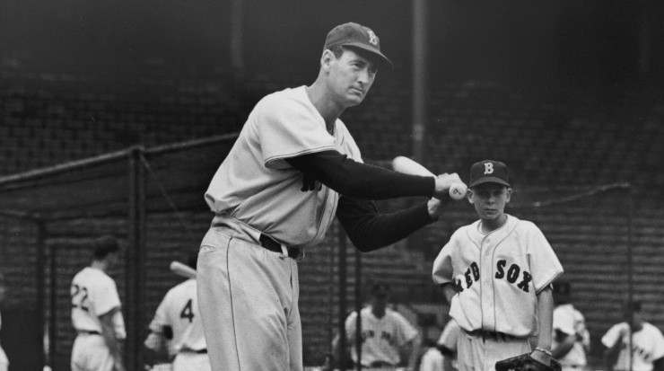 Baseball legend Ted Williams (1918 - 2002) of the Boston Red Sox swings a bat at a ball during a pre-game practice circa 1945 (Getty Images).