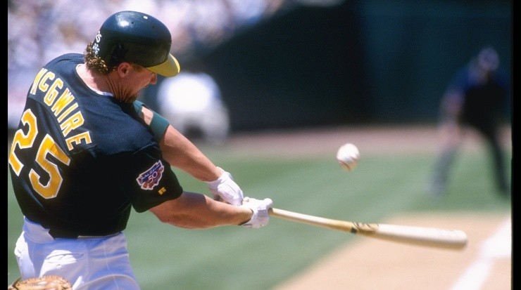 Mark McGwire #25 of the Oakland Athletic&#039;&#039;s hits the ball during their interleague game against the Colorado Rockies at Oakland Coliseum in 1997 (Getty Images).