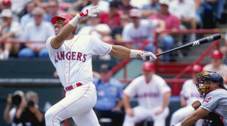Juan Gonzalez #19 of the Texas Rangers starts to run after hitting the ball during the game against the Cleveland Indians at The Ball Park in Arlington, Texas in 1999 (Getty Images).