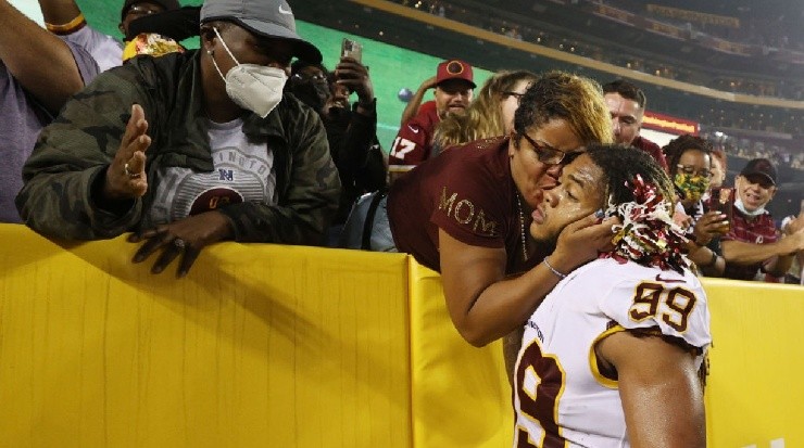 Chase Young with his mom Carla Young after a game.