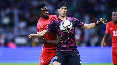 Alphonso Davies of Canada battles for possesion with Raúl Jimenez of Mexico.