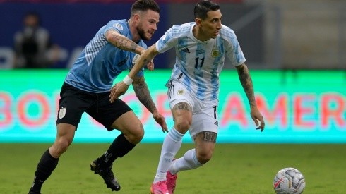 Argentina's Angel Di Maria (right) fights for the ball with Uruguay's Nahitan Nandez