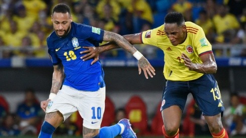 Neymar of Brazil (left) against Yerry Mina of Colombia.