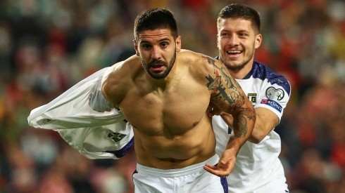 Aleksandar Mitrovic (left) of Serbia celebrates after scoring
