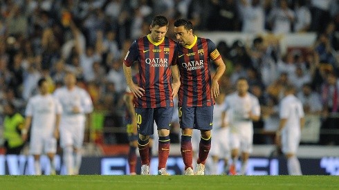 Messi y Xavi como compañeros en 2014.