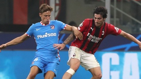 Marcos Llorente of Atletico Madrid (left) and Sandro Tonelli of Milan