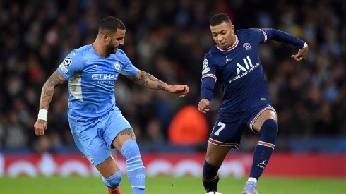 Kyle Walker of Manchester City and Kylian Mbappe of PSG