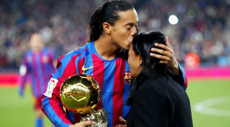 Ronaldinho of Barcelona kisses his mother as he holds the Ballon D&#039;Or award in 2005. (Denis Doyle/Getty Images)