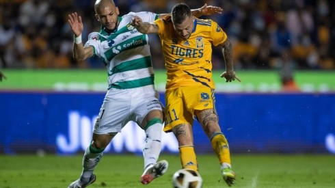 Matheus Doria of Santos (left) fight for ball control against Nicolas Lopez of Tigres