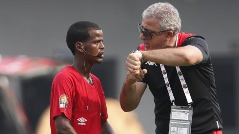 Tunisia head coach Mondher Kebaier points his watch to complain to Zambian referee Janny Sikazwe for ending the Mali vs Tunisia game prematurely.