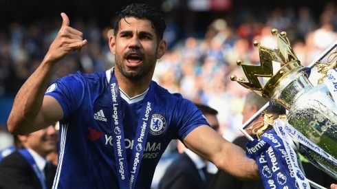 Diego Costa of Chelsea poses with the 2017 Premier League Trophy