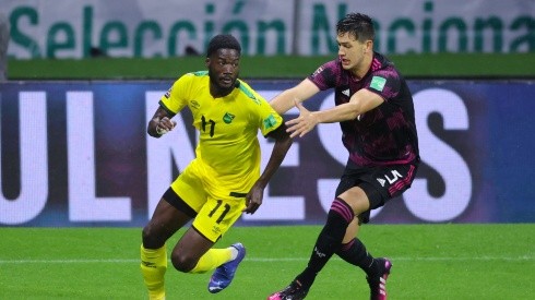 Shamar Nicholson of Jamaica battles for possesion with Cesar Montes of Mexico