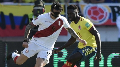 Gianluca Lapadula of Peru (left) against Davinson Sanchez of Colombia.