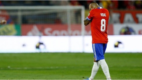Arturo Vidal of Chile walks off the field after being sent off during a match between Chile and Ecuador