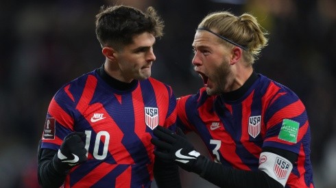 Christian Pulisic (left) and Walker Zimmerman celebrate during the USMNT's win over Honduras.