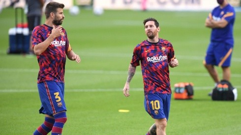 Gerard Piqué y Lionel Messi en un entrenamiento del Barcelona.