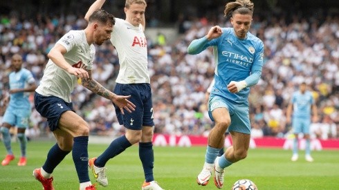 Pierre-Emile Højbjerg of Tottenham Hotspur closes down Jack Grealish of Manchester City