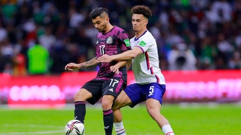 Jesus Corona (L) of Mexico fights for the ball with Antonee Robinson (R) of United States