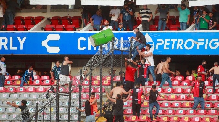 Fans of Atlas and Queretaro fight in the stands (Photo by Cesar Gomez/Jam Media/Getty Images)