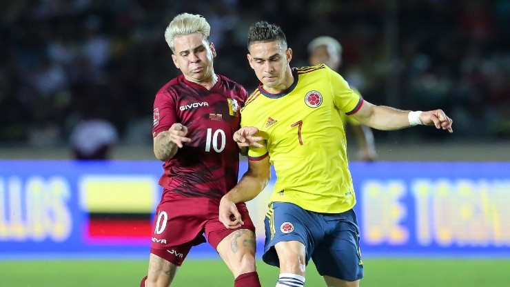 Yeferson Soteldo of Venezuela fights for the ball with Rafael Borré of Colombia