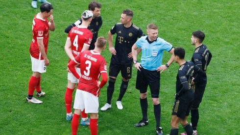 Freiburg and Bayern players during a break in play