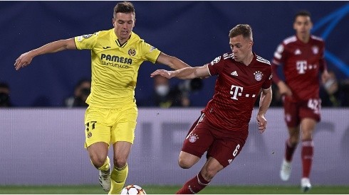 Giovani Lo Celso of Villarreal in action against Joshua Kimmich of Bayern Munich during Champions League match