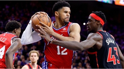 Tobias Harris of the Philadelphia 76ers is guarded by Pascal Siakam of the Toronto Raptors