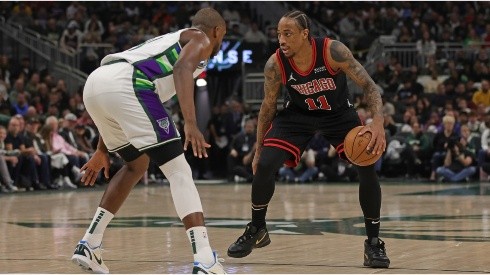 DeMar DeRozan of the Chicago Bulls is defended by Khris Middleton of the Milwaukee Bucks