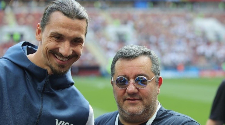 Raiola looks on with Zlatan Ibrahimovic prior to the 2018 FIFA World Cup Russia group F match between Germany and Mexico (Photo by Alexander Hassenstein/Getty Images)