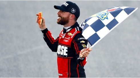 Chastain celebrates his victory at Talladega with a piece of watermelon he broke in his hand