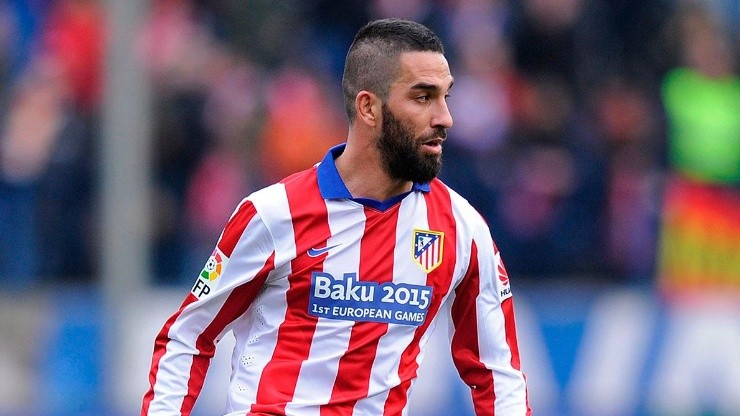 Turan con Atlético de Madrid.