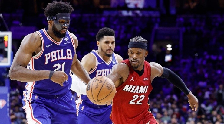 Jimmy Butler #22 of the Miami Heat dribbles against Joel Embiid #21 of the Philadelphia 76ers (Photo by Tim Nwachukwu/Getty Images)