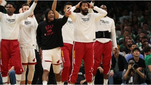 Members of Miami Heat bench react against the Boston Celtics