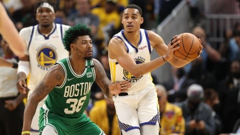 Jordan Poole #3 of the Golden State Warriors looks to pass the ball against Marcus Smart #36 of the Boston Celtics