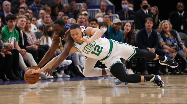 Grant Williams #12 of the Boston Celtics competes for a loose ball against Draymond Green #23 of the Golden State Warriors (Photo by Lachlan Cunningham/Getty Images)