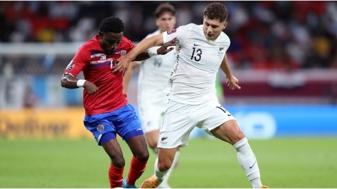 Keysher Fuller of Costa Rica battles for possession with Liberato Cacace of New Zealand
