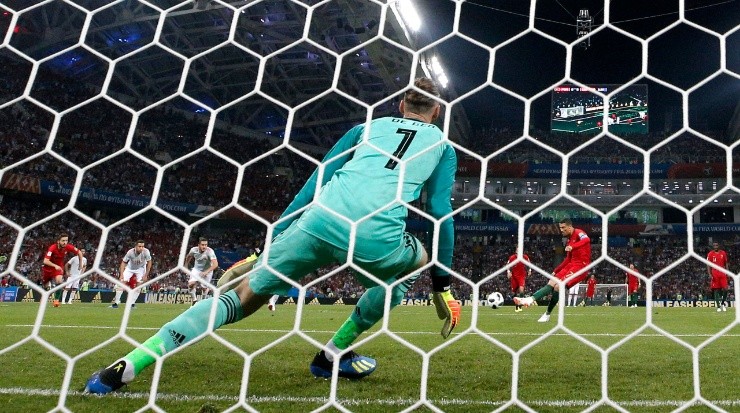 David de Gea trying to save a penalty kicked by Cristiano Ronaldo. (Dean Mouhtaropoulos/Getty Images)