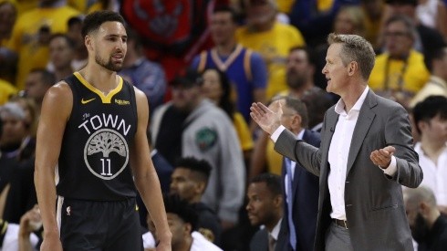 Klay Thompson #11 and Head coach Steve Kerr of the Golden State Warriors