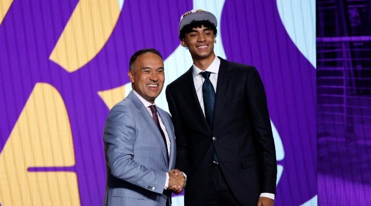 Deputy commissioner Mark Tatum and Max Christie pose for photos after Christie was drafted 35th overall by the Los Angeles Lakers during the 2022 NBA Draft (Photo by Sarah Stier/Getty Images)