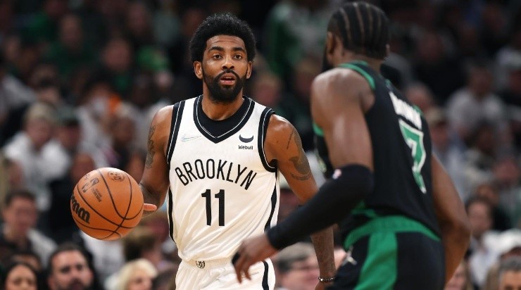 Kyrie Irving #11 of the Brooklyn Nets dribbles downcourt against Jaylen Brown #7 of the Boston Celtics  (Photo by Maddie Meyer/Getty Images)