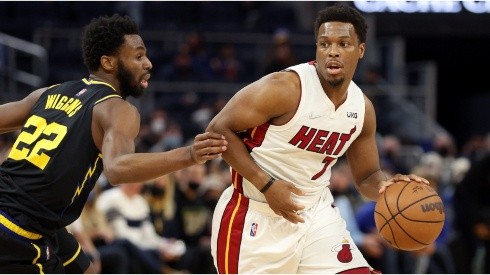 Kyle Lowry of the Miami Heat is guarded by Andrew Wiggins of the Golden State Warriors