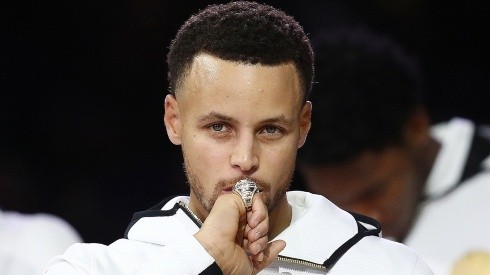 Stephen Curry of the Golden State Warriors kisses at his NBA Championship ring