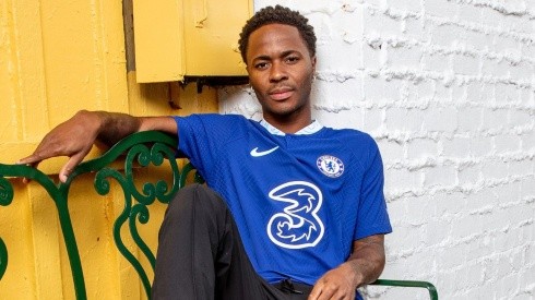 Raheem Sterling poses with the Chelsea jersey.