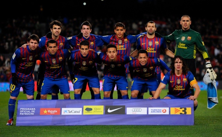 Dos Santos titular en Barcelona, junto a Dani Alves, en 2012. Créditos: Getty Images