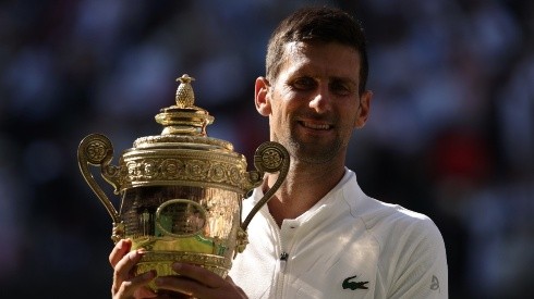 Novak Djokovic of Serbia with his 2022 Wimbledon trophy