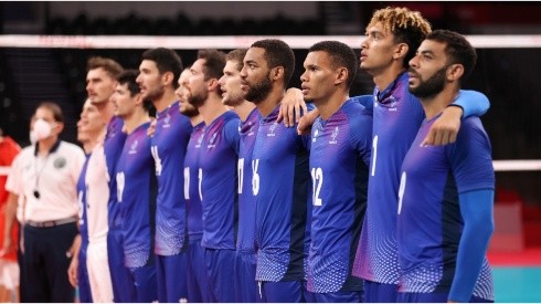 Players of Team France stand together for their national anthem