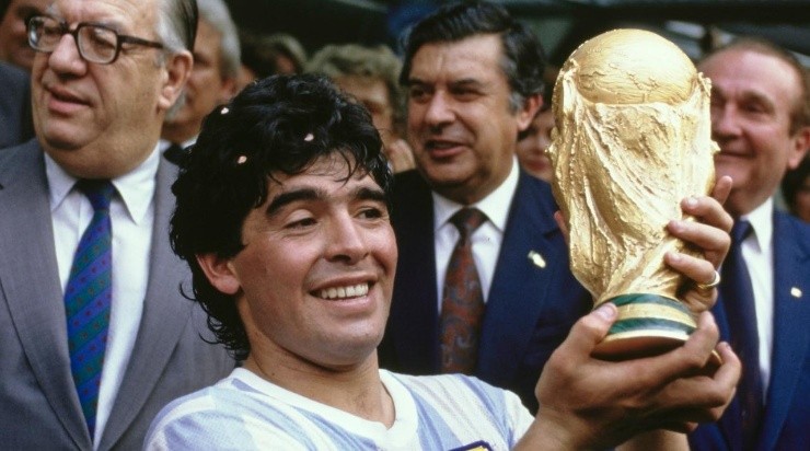 Argentina captain Diego Maradona holds aloft the trophy after the FIFA 1986 World Cup final match against West Germany at the Azteca Stadium (Photo by Mike King/Allsport/Getty Images/Hulton Archive)