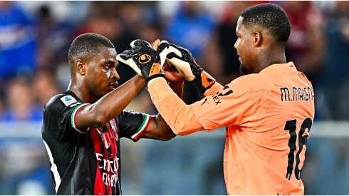 Pierre Kalulu (L) and Mike Maignan of Milan