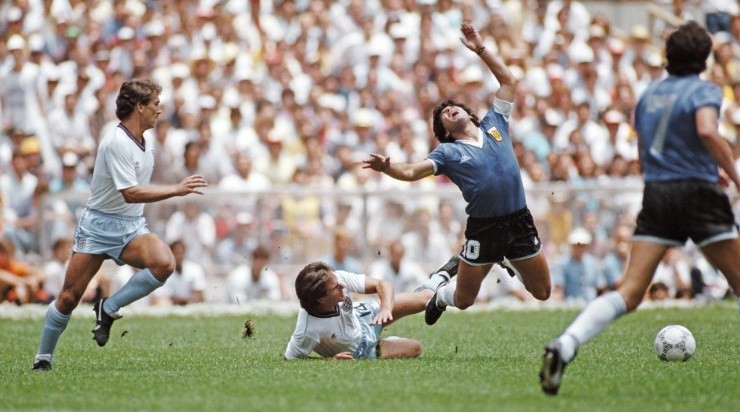 Argentina player Diego Maradona is challenged by England player Terry Fenwick as Kenny Sansom (l) looks on during the FIFA 1986 World Cup (Photo by Allsport/Getty Images/Hulton Archive)